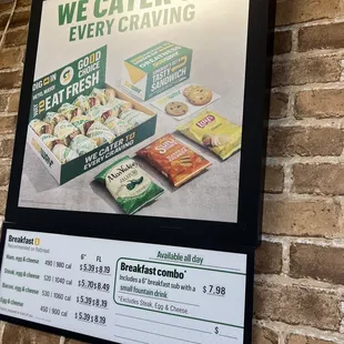 a menu for a restaurant with a brick wall