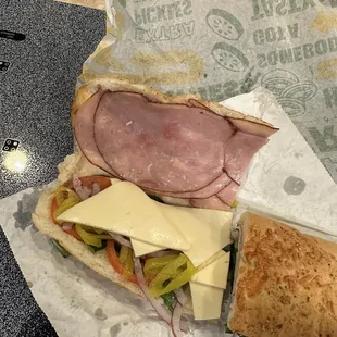 a sub sandwich with cheese and meat