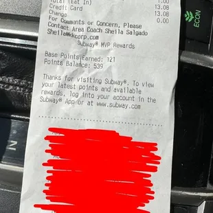 a parking ticket with a red marker on it
