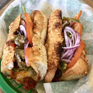 two sandwiches in a basket on a table