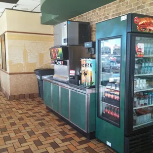 a view of a subway kitchen with a refrigerator