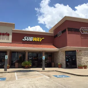 the entrance of a subway restaurant