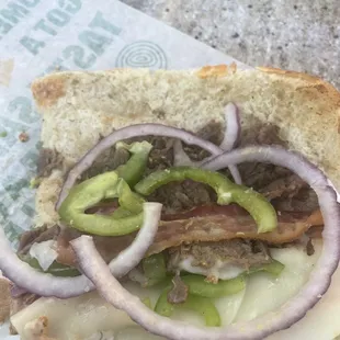 A "monster" sandwich that's supposed to have a full portion of steak, bacon, and double cheese. Don't eat at this location.