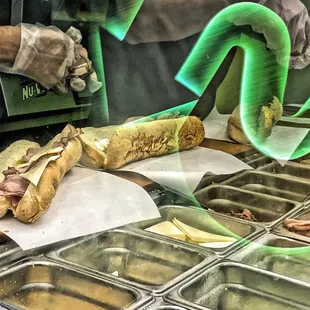 a hot dog being prepared for consumption