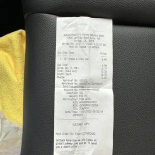 a receipt on the seat of a car