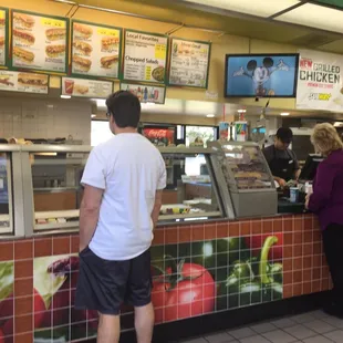 a man and a woman ordering food
