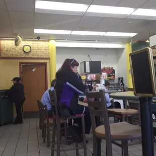 A few people sitting down but plenty of room for a few more