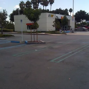 the empty parking lot of a subway station