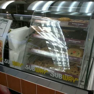 a display case with a variety of food items