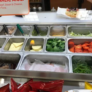 a variety of salads in containers