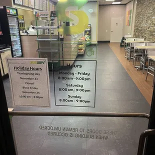 a sign in the window of a subway restaurant