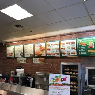 menus on the wall of a subway restaurant