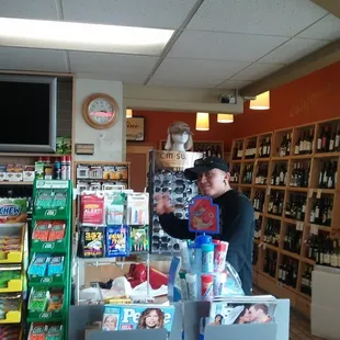 a woman standing in a liquor store