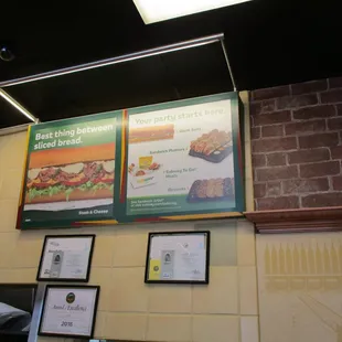 menus on a brick wall in a restaurant