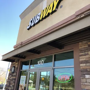 the entrance of a subway restaurant