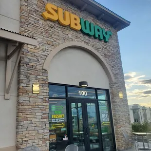 the entrance of a subway restaurant