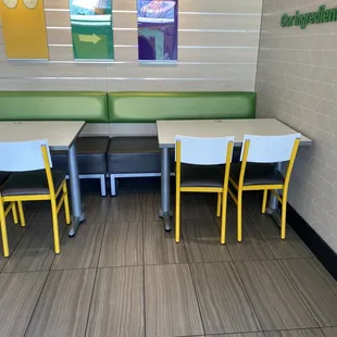a row of tables and chairs in a restaurant