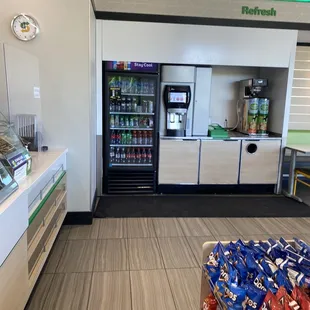 a refridgerator and a snack counter