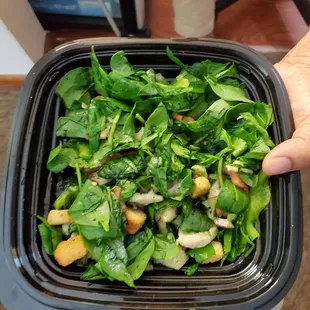 This is a "chopped, oven-roasted chicken salad with lettuce, tomatoes, cucumbers, green peppers, red onions, black olives, and spinach?"