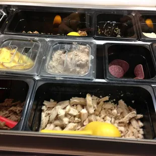 a variety of food in plastic containers