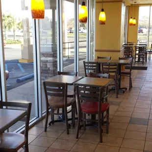 empty tables and chairs in a restaurant