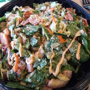 a salad in a bowl with dressing