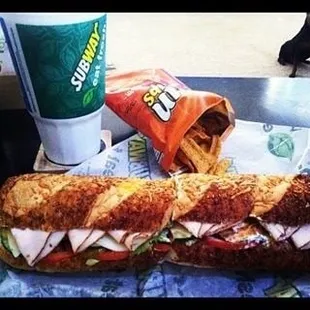 a sandwich and chips on a table