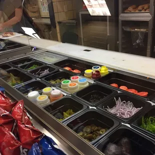 a deli counter with a variety of food items