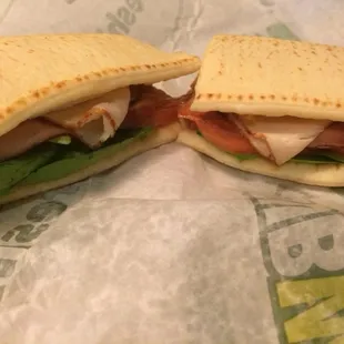 Footlong sunrise flatbread (egg,turkey,bacon) with spinach and tomato