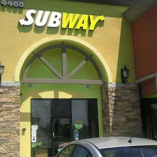 a car parked in front of a subway subway