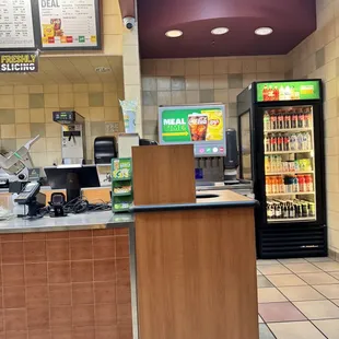 a view of a restaurant counter with a vending machine