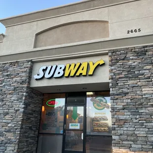 the entrance of a subway restaurant