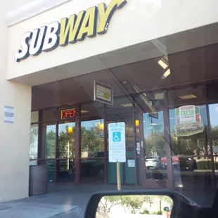 the entrance of a subway restaurant