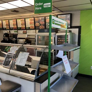 the counter area of a subway restaurant