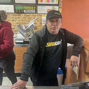 Subway employee with welcoming smile who threatened customer