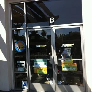 the entrance to a subway restaurant