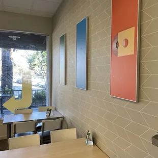 a dining area with tables and chairs