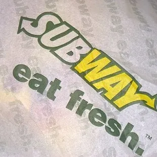 a subway sandwich wrapped in plastic