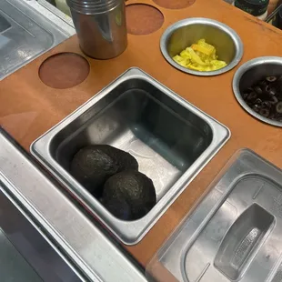 a counter with a variety of food items