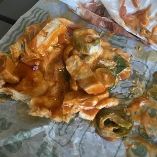 a partially eaten pizza on a table