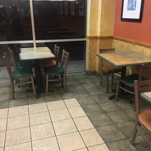 empty tables and chairs in a restaurant