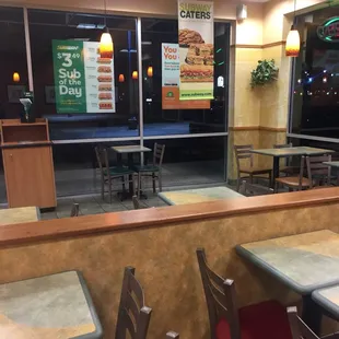 empty tables and chairs in a restaurant
