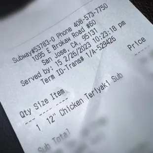 a close up of a receipt on a table