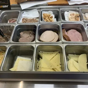 a variety of food items in trays