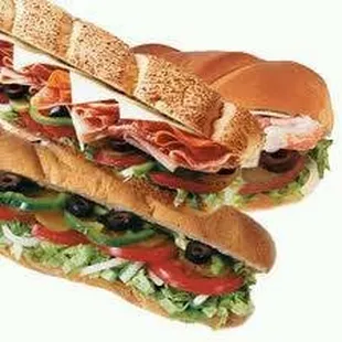 two sub sandwiches stacked on top of each other