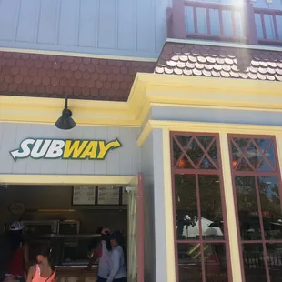 the entrance to a subway restaurant