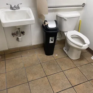 Notice the toilet paper on floor