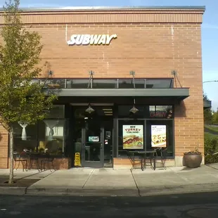 the entrance of a subway restaurant