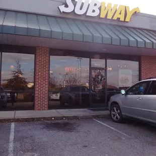 a car parked in front of a subway subway