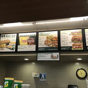 menus on the wall of a subway restaurant